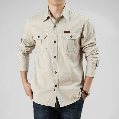 Beige long-sleeve shirt worn by a person on a plain background