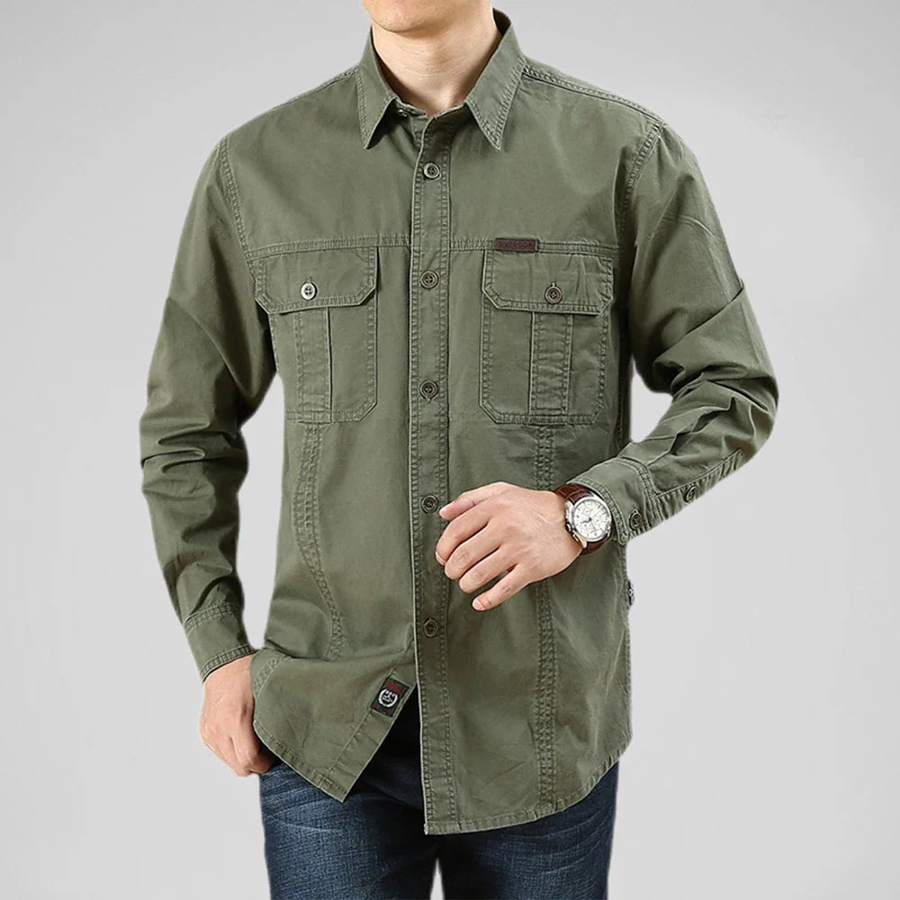 Green shirt worn by a person on a gray background